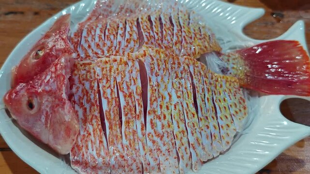 Fresh red snapper on a plate.