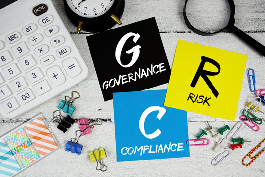 GRC Governance, Risk, and Compliance text phrase of business and financial concept