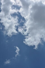 Obraz premium Dramatic Cloud Shapes In Bright Blue Sky