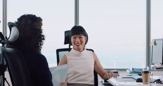 Creative, meeting and women with paperwork in office, discussion and plan for ad budget or campaign. Business, media strategist and people with documents for pr assignment, talking and collaboration