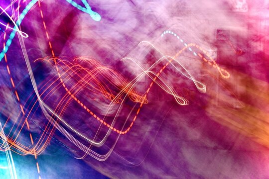 Abstract colorful light trails with smoke texture and vibrant motion background