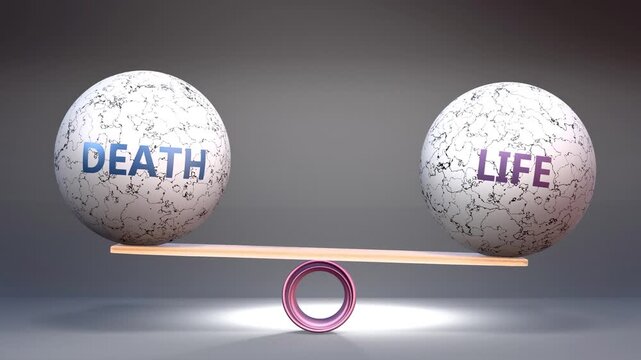 Death and life in balance - balancing stones on a scale symbolizing harmony, equity and equilibrium between death and life. Harmonious and beneficial situation.