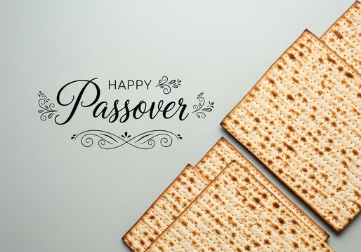 Traditional matzah bread on a white background with a happy passover message