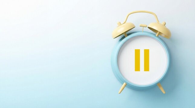 Blue alarm clock with pause symbol on face with yellow bells