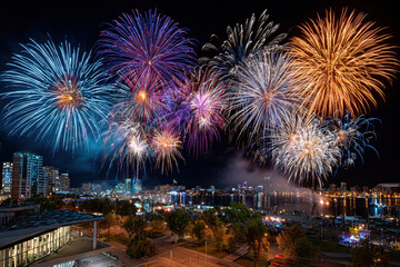 Fototapeta premium Dazzling Fireworks Light Up the Night Sky Over City