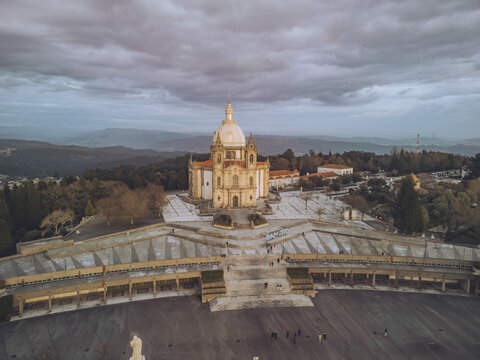 Aerial view of the Santuario de Nossa Senhora do Sameiro basks in the fading light, a beacon of faith against the backdrop of Braga's landscape, Braga, Braga, Portugal.