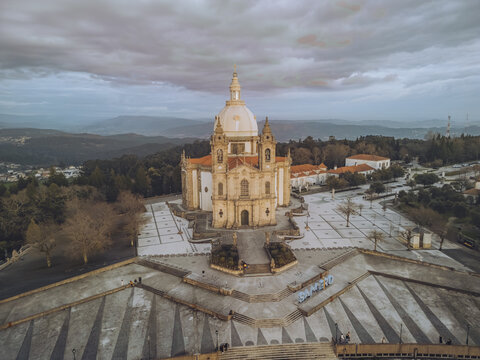 Aerial view of the Santuario de Nossa Senhora do Sameiro bathed in the soft light of dusk, its dome a beacon against the muted sky, Braga, Braga, Portugal.