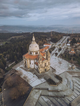 Aerial view of the Santuario de Nossa Senhora do Sameiro stands majestically, its pale dome contrasting with the surrounding landscape, Braga, Braga, Portugal.