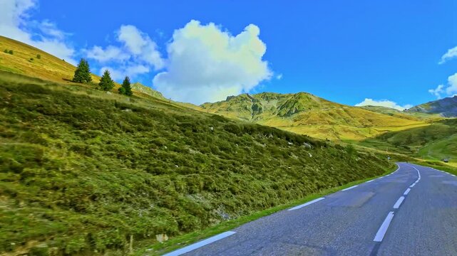 Driving up the Col du Tourmalet steep road, located in the center of the Pyrenees chain, in the Hautes-Pyrenees department in France, highest mountain pass in Pyrennes, famous Tour de France climb