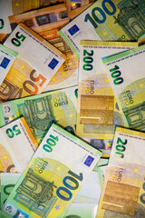 Obraz premium Euro bank notes. 50, 100, 200 euros. Pile of money.