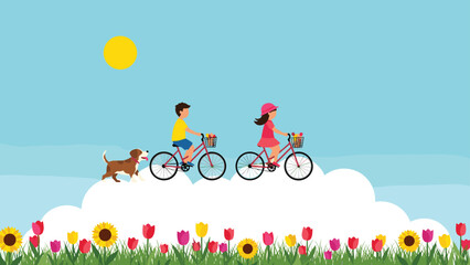 Naklejka premium Young boy and girl riding bicycles with flower baskets through a bright blue sky above fluffy white clouds and a field of tulips.