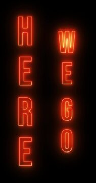 Here We Go in neon lights on screen. Loop. 4K Vertical