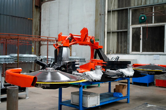 Scene of agricultural machinery components in factory workshop