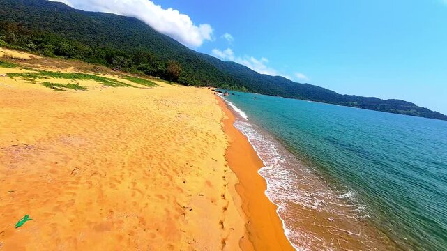 Cinematic FPV drone flight over Son Tra Peninsula in Da Nang, Vietnam, featuring tropical beaches, coastline and dramatic clouds from an immersive aerial perspective.