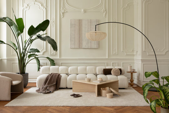Minimalist living room with modern modular sofa, soft rug, plants, and elegant decor, creating a calm home interior