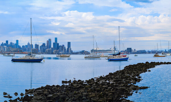 Melbourne city skyline and seascape over Hobsons Bay, viewed from Williamstown in Victoria, Australia