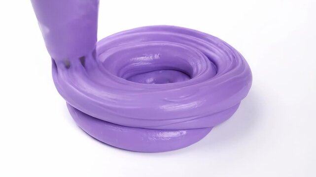 Close-up of Purple Slime Being Poured and Swirled on White Background.