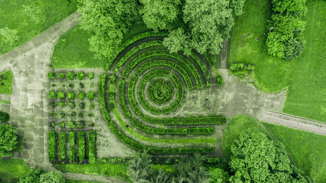 Aerial view of lush green patterns formed by bushes and trees creating a mesmerizing maze-like design, Sremska Mitrovica, Vojvodina, Serbia.