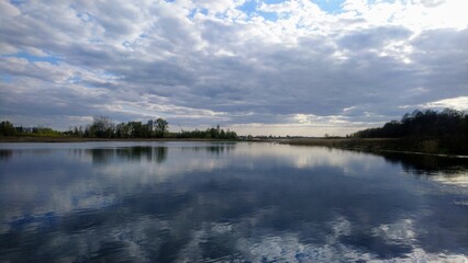 Obraz premium Scenic landscape of the Zdvizh river with stunning cloud reflections in Ukraine