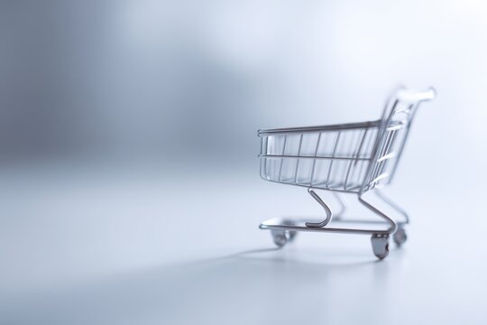 Small metal shopping trolley symbol of online shopping business