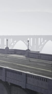 A majestic bridge stands shrouded in thick fog, creating a calm yet mysterious atmosphere in the quiet city. The surrounding streets are deserted, amplifying the serene beauty.