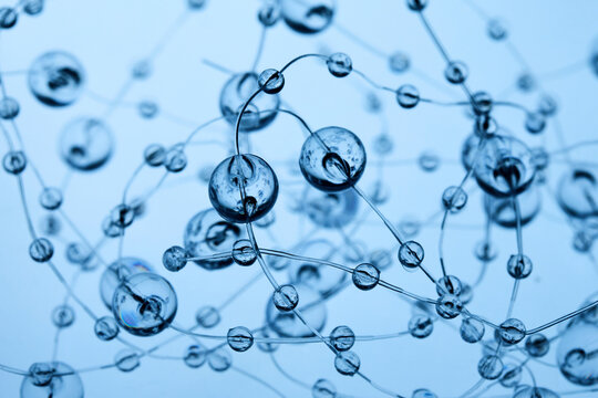 Transparent spheres forming abstract network connection blue background