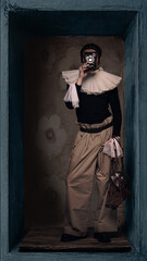 Naklejka premium Portrait man in ruffled collar holding vintage camera in front of face inside box. Concept of hidden identity, self perception, creative photography process, visual storytelling and artistic vision.