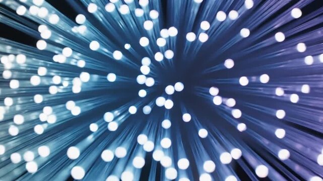 Abstract fiber optic light background with blue glowing lines and bokeh particles