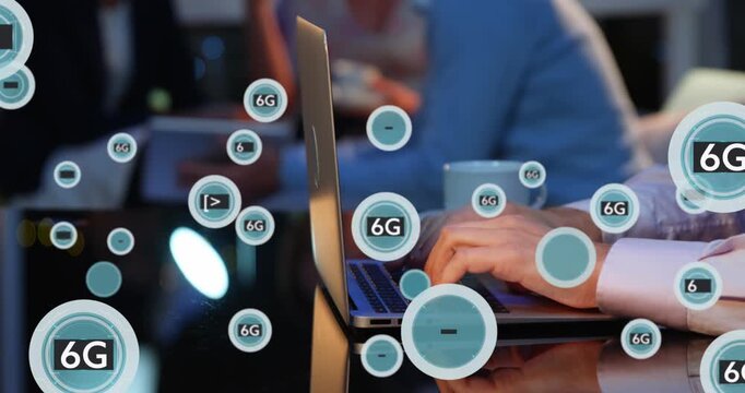 Animation of 6g text and symbols in circles over cropped hands of caucasian man working on laptop