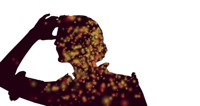 Animation of dots in silhouette of woman looking with hand on forehead looking far away