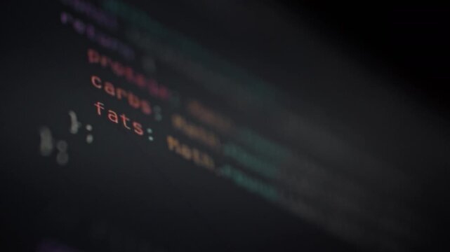 On a monitor screen, a dynamic stream of numbers and symbols rapidly updates, illustrating the intricate data processing of an artificial intelligence system in real-time