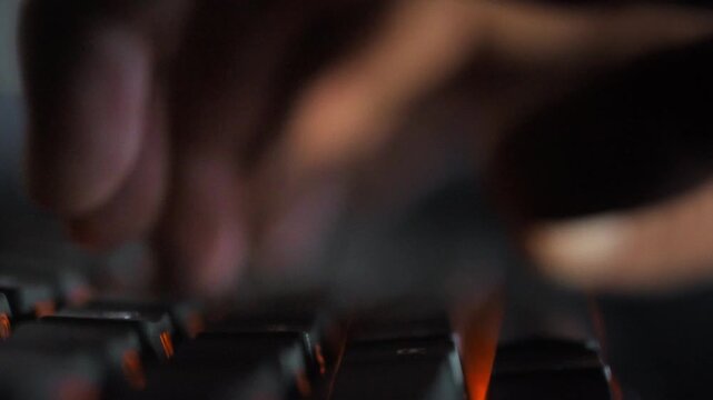 In a dimly lit coding studio, fingers fly across a keyboard as a programmer rapidly types away, fueled by the concept of AI-driven automation. Swift keystrokes bring innovative coding ideas to life