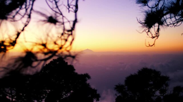 Cloudy colorful sundown from the best view point Pico de las Nieves, in the middle of Gran Canaria, from the highest mountain of the island over the clouds, with a special view to the Teide, Tenerife