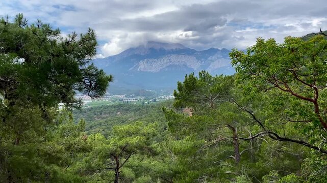 Hiking in the mountains with a view of Tahtali and the Taurus mountain range. Camyuva, Kemer, Turkey. 4k