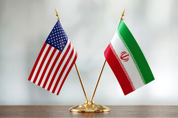 United States and Iran flags side by side on table