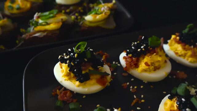 Delicious deviled eggs appetizer with black caviar