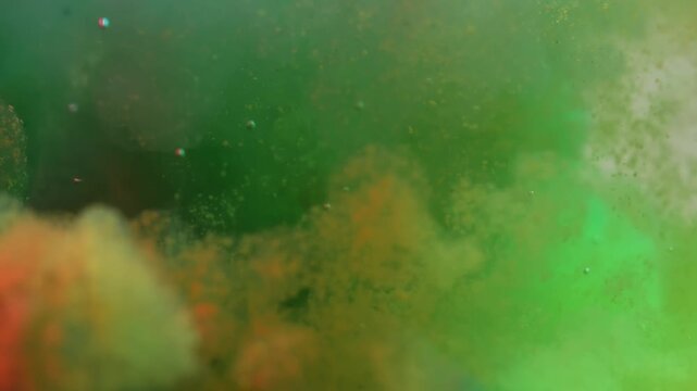 Green and yellow paint cloud spreading in water on a white background. Premium marketing concept for overlay effects, creative branding, banner and advertising layout design, ecology, beauty, and