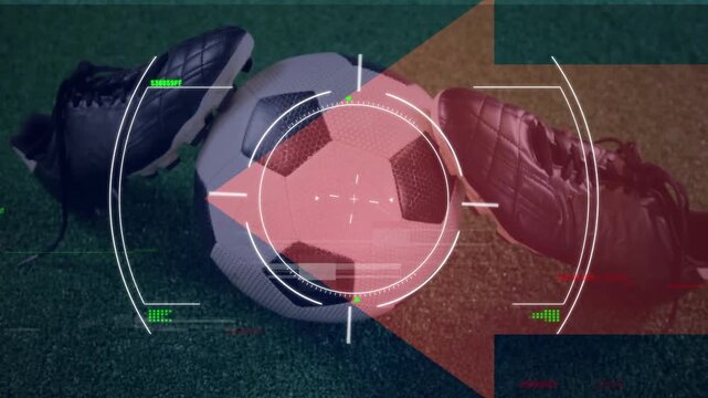 Animation of glitch effect and scope scanning over close up of soccer ball and cleats on grass field
