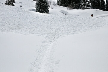 Fototapeta premium Huge avalanche debris and snow mass on the road to Mynzhylky in the mountains near Almaty