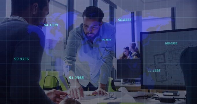 Man leaning over desk, pointing and activating blue data overlay while team aligning design plans