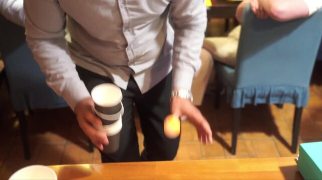 Guy Making the Gesture of Throwing the Ball into the Rival's Cups in a Beer Pong Game During a wedding Party