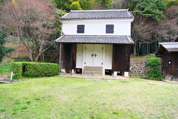 Traditional Japanese white-walled storehouse (Kura) surrounded by nature: Historical warehouse landscape © taka