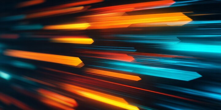 Bright streaks of orange and blue light race forward in a dark abstract scene.