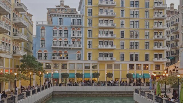 Doha, Qatar-March 26 2026:Qanat Quartier The pearl, Doha Qatar sunset shot showing the unique architecture of the building , water canals and visitors