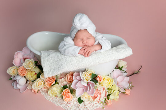 Sweet Newborn Baby in Bathtub with Flowers