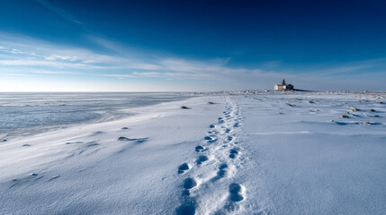 Obraz premium Footprints in the snow leading to a small distant outpost. Life in permafrost conditions, climate change problems on the planet. Global warming