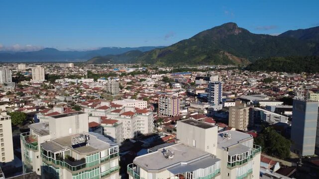 Aerial View of Coastal City with River and Serra do Mar Mountains Caraguatatuba S&atilde;o Paulo Brazil 4K