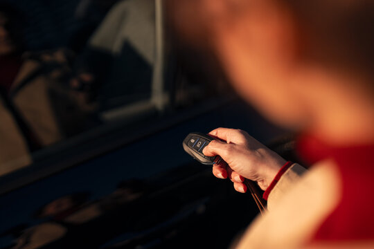 Hand unlocking car with modern remote key fob