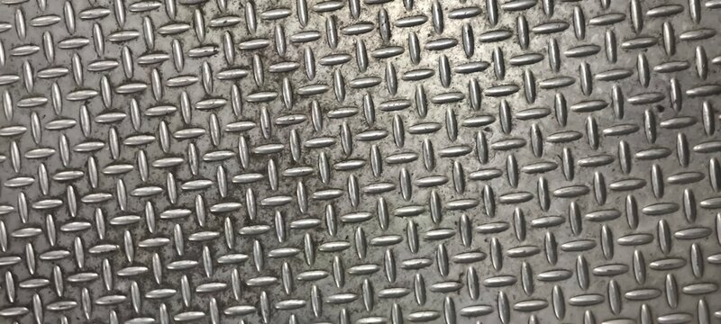 The diamond plate  also known as tread plate or checkered steel plate. which is a type of metal stock with a regular pattern of raised diamonds or lines on one side.