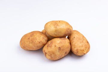Fototapeta premium Fresh potatoes on a white background